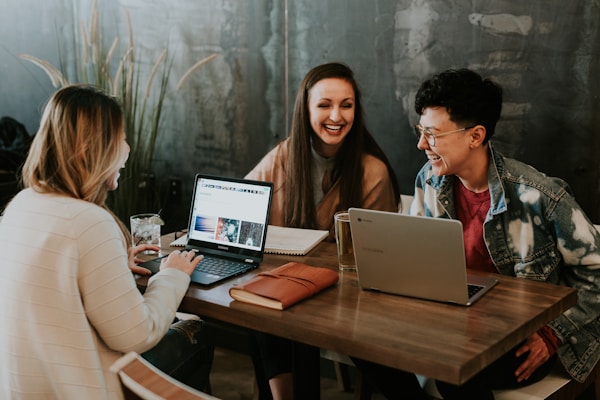 Founders working together on laptops